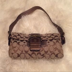 Classic Coach purse with snakeskin embellishment